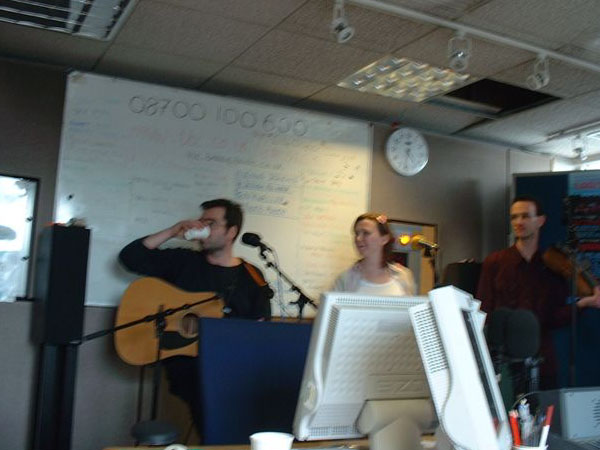 Mark, Emma and Tom, seated and ready to ROCK the airwaves.