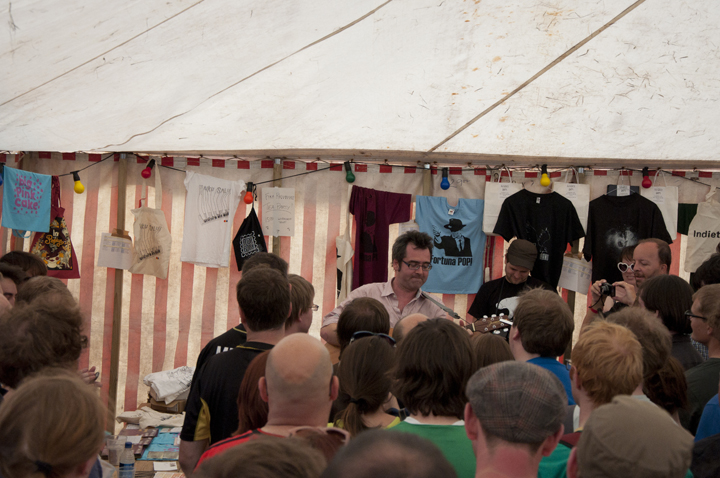 Later on, in the merchandise tent: Guerilla gig time!